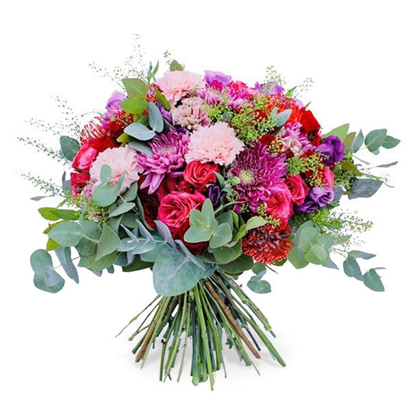 A mixed flower bouquet with white and pink carnations, chrysanthemums, spray roses.
